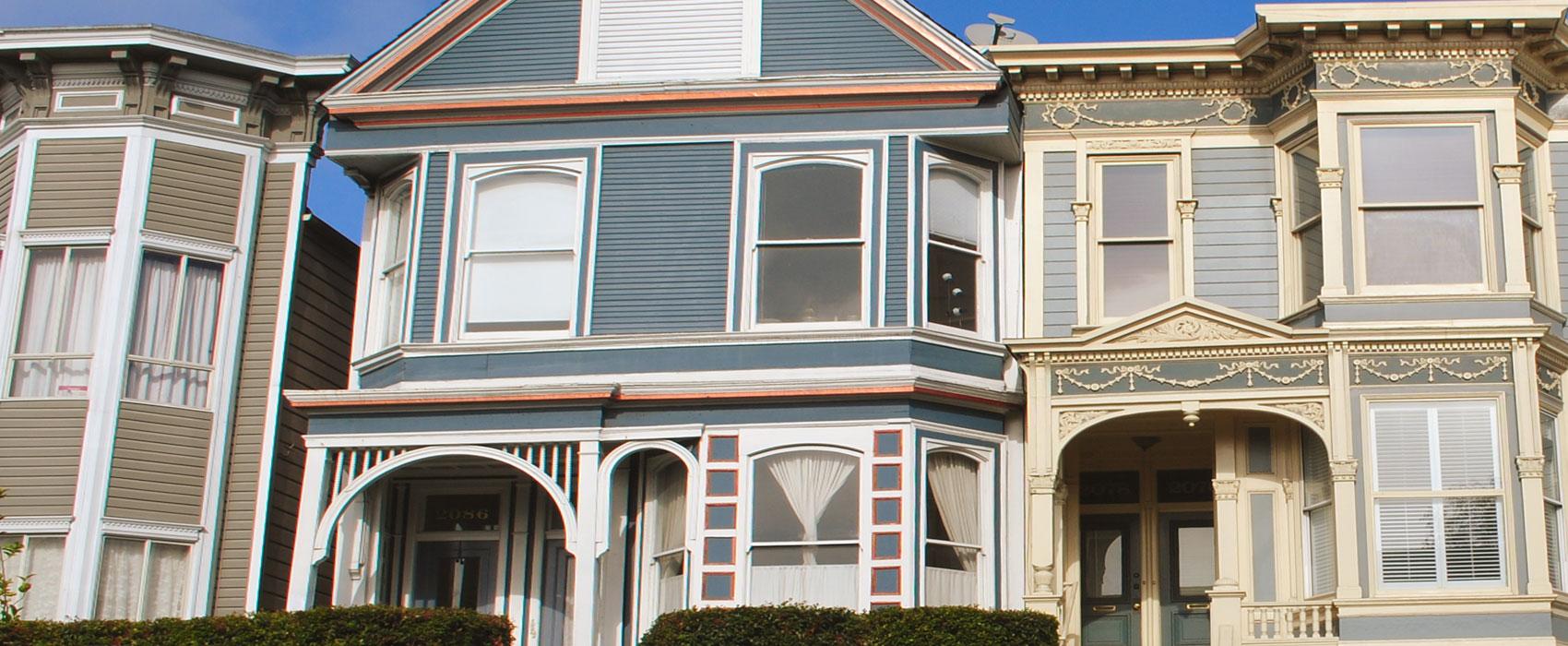 three homes with differing styles of windows